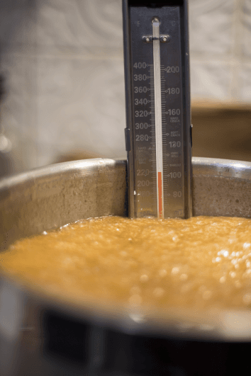 Clean candy making workspace with thermometer