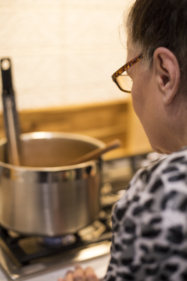 Carla checking temperature while cooking candy centers